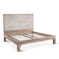 the bed frame has an intricate design on it