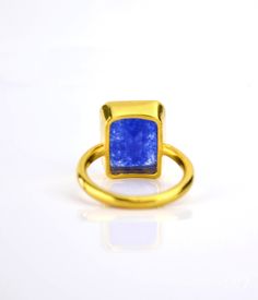 This beautiful bezel set ring is made with large rectangular faceted natural Blue Jade in 18K Vermeil Gold. The ring has a 925 stamp. Gemstone size is 13 x 18 mm. Please specify your size at checkout. Since I use natural gemstones, the stones may vary slightly in color, shape and size. Due to the nature of this stone there are natural inclusions and small internal cracks. This ring is available in two finishes: ✦ 18K VERMEIL GOLD ✦ BRIGHT STERLING SILVER Please leave me a note at checkout which Rectangular Gold Emerald Ring With Bezel Setting, Luxury Rectangular Emerald Ring As A Gift, Rectangular Emerald Ring With Bezel Setting, Rectangular Sapphire Rings For Gifts, Rectangular Emerald Ring As A Gift, Rectangular Sapphire Ring As Gift, Rectangular Emerald Ring With Bezel Setting As Gift, Gold Rectangular Sapphire Promise Ring, Handmade Yellow Gold Rectangular Rings