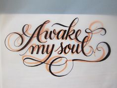 the words awake my soul are written in cursive black ink on white paper