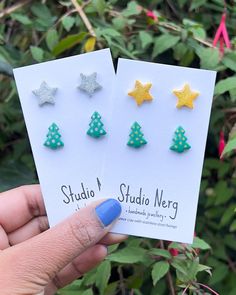 Get Christmas-ready with these sparkly star studs and cute Xmas tree earrings. This Christmas stud set is handmade from polymer clay and have hypoallergenic stainless steel earring posts. Each one is roughly 13mm in height. These make the perfect accessory for Christmas Jumper Day and all of you Christmas parties! All jewellery is handmade by me in London. There are slight variations in size and colour compared to the photos and there may be minor imperfections in each piece, making each one uni Christmas Jumper Day, Tree Star, Tree Earrings, Christmas Jumper, Earring Tree, Christmas Parties, Earring Posts, Stud Set, Holographic Glitter