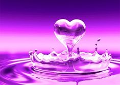 a heart shaped water drop in purple and pink