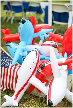 an assortment of inflatable airplanes and american flags