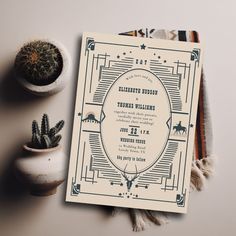 an art deco inspired wedding card with a cactus