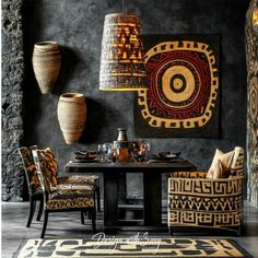 a dining room table with chairs and lamps on the wall next to it is decorated in african style