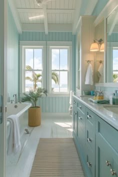 a bathroom with two sinks and a bathtub next to a window in the wall