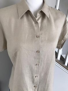 "Vintage linen shirt. Classic button down shirt Mint condition! Cap short sleeves Easy comfort wear size: 1XL Length 26\" Arms: 5\" Shoulder to shoulder 16\" Arm pit to pit 21.75\" fabric: 100% Linen Comes from smoke/pet free home Comes from smoke/pet free home" Classic Short Sleeve Blouse With Placket, Casual Fitted Blouse With Rolled Sleeves, Classic Short Sleeve Shirt With Button Closure, Classic Beige Collared Short Sleeve Shirt, Classic Beige Short Sleeve Shirt, Classic Short Sleeve Button-up Shirt, Fitted Linen Button-up Short Sleeve Shirt, Classic Short Sleeve Blouse With Button Closure, Classic Short Sleeve Blouse With Rolled Sleeves