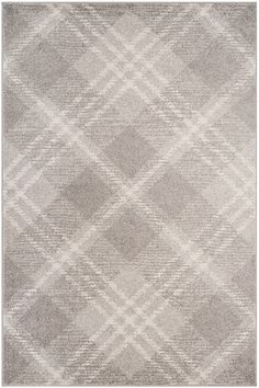 an area rug with grey and white checkered pattern on the side, in front of a