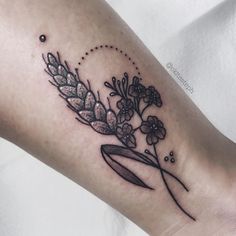 a close up of a person's arm with flowers on it