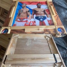 a wooden box with an image of two men in boxers on the front and side