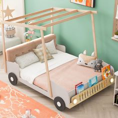 a child's bed with a wooden frame and wheels