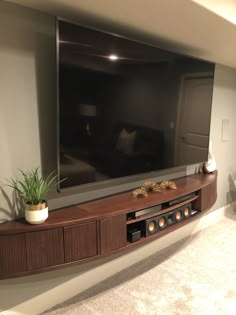 a large flat screen tv mounted to the side of a wall