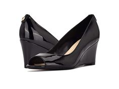 Nine West Cape9X9 - High Heels : Black Patent : The Nine West Cape9X9 peep toe wedges are perfect for any formal or casual meeting. Leather upper. Synthetic lining. Slip-on closure. Peep toe construction. Wedge heel silhouette. Imported. Heel height: 3 inches. Weight of footwear is based on a single item, not a pair. Modern Formal Wedge Sandals With 4-inch Heel, Formal High Heel Wedge Sandals With 4-inch Heel, Elegant Wedge Heel Sandals For Spring, Formal Spring High Heel Wedge Sandals, Spring Workwear Wedge Heels, Formal Wedge Sandals Medium Width, Elegant Wedge Sandals With Round Toe, Elegant Medium Width Platform Wedge Sandals, Elegant Fitted High Heel Wedge Sandals