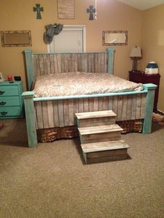 a bed sitting on top of a wooden platform in a bedroom