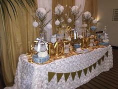 a table topped with lots of cake and decorations