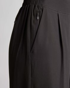 These look like classic work pants, but move like your favorite activewear. Our cropped Performance Tech Wide Leg Commuter Pants have just the right amount of stretch for days when you’re on the go, plus the sun protection and quick-dry properties of top-notch performance wear. And they look great with sneakers.  | Quince | Women's Performance Tech Wide Leg Pants in Black, Size XL, Recycled Polyester Black Athletic Pants, Golf Pants Women, Work Pants Women, Winter Pants, Prom Dresses Vintage, Performance Leggings, Performance Wear, Golf Pants, Athletic Pants