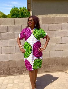 This is a unique African midi dress in a multi-print. This comfy dress will be made from Ankara fabric cut to flatter your curves.  Style is loosely cut for wiggle room.  The fabric pictured may not be available, please scroll through all photos for available fabric.   *Made to order, length is up to 40"- 42" but can be made shorter per customer request.   MEASUREMENT GUIDE: See inserted pics We are happy to answer any questions regarding measurements and styles before purchase. Note, that the customer is responsible for including their measurements or selecting the correct measurements. Where no measurements are included, we will use the listed measurements with the size selection. *️⃣FEATURES 🔸 Length Displayed = Shoulder to hem 40-42" 🔸 Model is 5'7" and wearing heels *️⃣ Colors: Whit Multicolor Print V-neck Dress With Patchwork, Multicolor Printed Knee-length Mini Dress, Multicolor Vibrant Print Knee-length Mini Dress, Multicolor V-neck Mini Dress With Patchwork, Multicolor Knee-length Mini Dress With Vibrant Print, Multicolor Knee-length Dress With Vibrant Print, Green Printed Knee-length Dress, Multicolor Printed Knee-length Dress, Patterned Abstract Print Short Sleeve Dresses