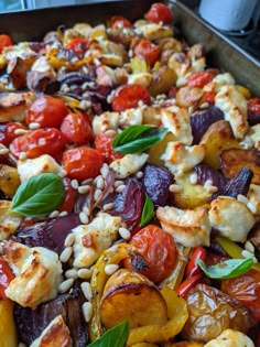 a pan filled with lots of different types of food