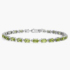 Truly bright and festive, this gemstone bracelet features vibrant peridot gemstones framed in a delicate sterling silver setting. Precious Gemstones Jewelry, Peridot Gemstone, Gemstone Bracelets, Gemstone Bracelet, Semi Precious Gemstones, Gemstone Jewelry, Jewelry Bracelets, Diamonds, Bracelet