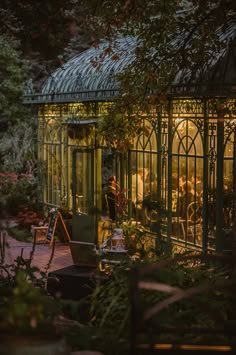 a person standing in front of a glass house