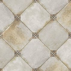 a tile floor with white and brown tiles on it's sides, showing the diamond pattern