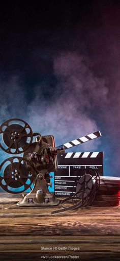 a movie projector sitting on top of a wooden table