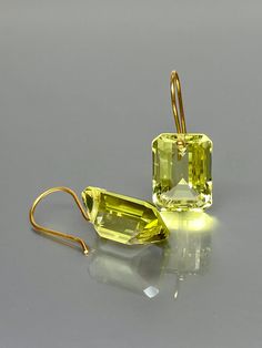 Gorgeous Lemon Quartz gold earrings. The faceted emerald-cut drops are Flawless and have a beautiful bright yellow color. The drops are attached to 24K gold vermeil /14K SOLID GOLD ear wires. The earrings are elegant and have a lux look. A truly gorgeous pair of earrings. When 14K SOLID GOLD ear wires are being used, the ear wire ends are hand stamped as proof of being 14K solid gold. In addition, extra work was done at the end of the ear wires to prevent any sort of pain or injury while inserti Chanel Stud Earrings, Pink Topaz Earrings, London Blue Topaz Earrings, Ruby Earrings Studs, Gold Earrings For Women, Citrine Earrings, Blue Topaz Earrings, Solid Gold Earrings, Quartz Jewelry