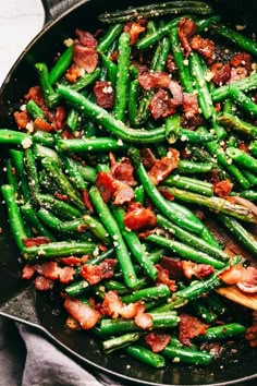 green beans and bacon cooking in a skillet