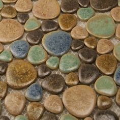 a close up view of some rocks and stones with different colors on the top one