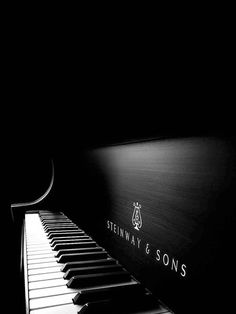 a black and white photo of a piano with the words, benway & sons on it