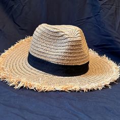 The Hat Has Never Been Worn. It Is Made Entirely Of Paper Straw With An Inch Wide Black Ribbon Around The Base Of The Hat Where It Needs The Rim. It Is A Medium Sized Rim About 3-4 Inches Wide From The Base Of The Hat. About A 7-9 Inch Diameter To Fit The Average Sized Head. Super Cute Perfect Had For Summer Beach Days! Black Summer Hat For Warm Weather, Black Wide Brim Hat For Warm Weather, Adjustable Casual Straw Hat One Size, Adjustable Casual Straw Hat, Black Casual Sun Hat For Warm Weather, Black Casual Hat For Warm Weather, Casual Black Hat For Warm Weather, Casual Straw Hat One Size, Casual Brown Hats For Warm Weather