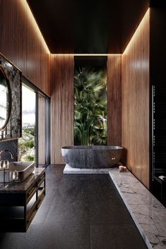 a bathroom with a large bathtub next to a walk in shower