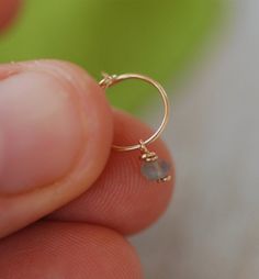 ❤️ SINGLE HOOP WITH TINY CLAPS + wire wrapped faceted LABRADORITE bead stone. Perfect for ALL piercings: nose, helix, ear, tragus, cartilage, snug, lower / upper earlobe, 2nd and 3rd piercings. ► Please choose material for your hoop: 100% 14K gold filled 100% Silver Sterling ►Please choose inner DIAMETER for your hoop: 6/7 mm (snug/tragus piercing fit) 8 mm (common for all types- nose, upper earlobe fit) 9/10 mm (lower earlobe) 11 mm (conch fit) Everyones facial features are different ☺ To get a Piercings Nose, Helix Ring, Earring Cartilage, Cartilage Ring, Tragus Earring, Helix Hoop, Helix Earring, Gold Bond, Cartilage Earring