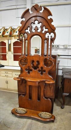 an old wooden grandfather clock in a shop