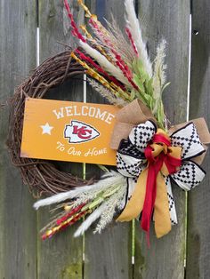 a football wreath with a welcome sign on it