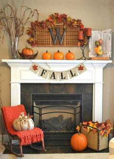 a fireplace decorated with fall decorations and pumpkins