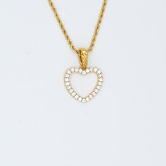 Introducing the Gold Heart Necklace! This beautiful piece is perfect for any special occasion. The gold heart pendant is adorned with sparkling white stones, making it a truly luxurious accessory. The dainty chain is versatile, so you can wear it in any setting. Treat yourself or someone special to this gold heart necklace! Gold Presidents brings you the highest standard of jewelry. Material Options 18k White Gold Plated Stones: Cz Stones What chains can fit this pendant? Up To 3mm Tennis Chain Ankle Jewelry, Tennis Chain, White Stones, Diamond Jewelry Necklace, Heart Pendant Gold, Dainty Chain, Gold Heart Necklace, Diamond Chain, Gold Heart