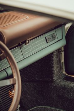 the interior of an old car with leather trim