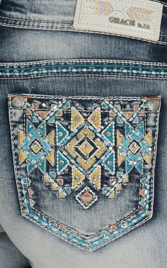 Grace in LA Women's Light Wash with Blue, Yellow, and Orange Aztec Embroidery Open Back Pocket Shorts | Cavender's Sparkly Jeans, Grace Jeans, Aztec Embroidery, Jeans Pocket, Cowgirl Jeans, Outing Outfit, Bling Jeans, Ideas Embroidery, Cute Country Outfits