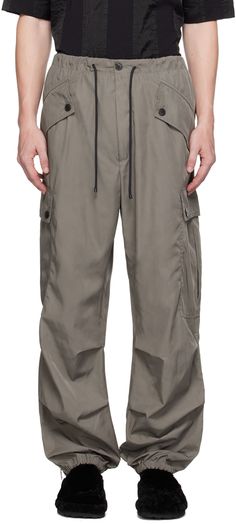 Heavyweight polyester taffeta cargo pants. · Drawstring at elasticized waistband · Four-pocket styling · Zip-fly · Elasticized cuffs · Cargo pocket at outseams · Zip vent at outseams · Unlined Supplier color: Grey Drawstring Cargo Pants, Cargo Pocket, Cargo Pants Men, Dries Van Noten, Cargo Pants, Apparel Accessories, Mens Pants, Top Brands, Luxury Fashion