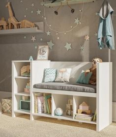 a child's room with toys and bookshelves