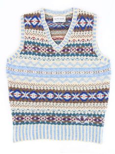 "This sleeveless sweater vest is made of soft Shetland wool, woven in a Fairisle pattern that gives it a classic 40s look. Hand-produced in Scotland using quality, natural yarns spun that keep you truly warm, by ERIBÉ, an established knitwear design house and manufacturer that has been in operation for 33 years. The Nordic blue tank top features rows of Fairisle patterning and stripes across the V-shaped neck, as well as on the bottom hem. This colourway is a mix of white, green, red and blue colours. A truly stand-out addition to a vintage enthusiast's wardrobe, these knits keep you warm and add a dash of colour to any retro outfit. 100% soft-feel Shetland wool, made using knowledge handed down from one generation to the next to create a sustainable product which looks and feels great whi Stranded Knitted Vest, Xl Fair Isle Vest, Norther Lights Fairisle Knit, Vintage Uniform, Vintage Fair Isle, Nordic Vintage, Nordic Blue, 1950s Retro, Sleeveless Sweater Vest