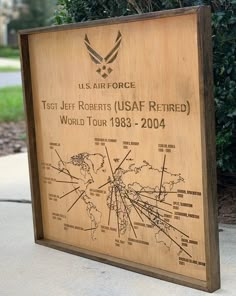 a wooden sign with an image of the us air force on it's side