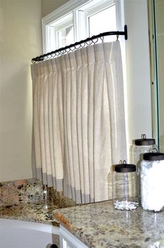 the curtain in the bathroom is open and ready for us to use