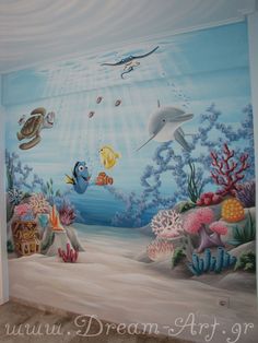 this is an underwater scene painted on the wall in a child's room with dolphins and other sea creatures