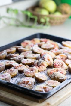 some food that is sitting on a tray and ready to be cooked in the oven