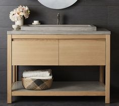 a bathroom vanity with a sink and mirror