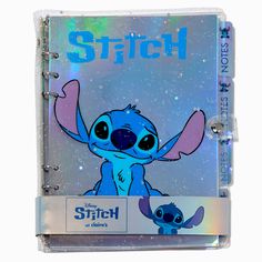 the stitch book is open to reveal an image of stitch and stitch with stars in the background