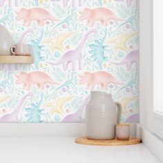 the wallpaper is colorful and has dinosaurs on it, as well as other decorations