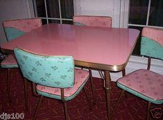 a pink table with six chairs and a window in the backround, next to a red carpeted floor