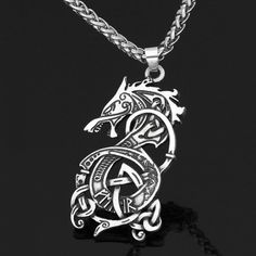 Discover the strength and cultural legacy of the Vikings with our Polished Sterling Silver Dragon Necklace. This meticulously crafted pendant, inspired by Norse mythology, is not just jewelry; it's a symbol of power and heritage. 🐉 Features:Symbolic Power: Embody the strength of Viking warriors.Cultural Heritage: Connect with Norse mythology and Viking traditions.Protection & Valor: The dragon signifies protection and valor on life's journey.Timeless Elegance: Crafted in high-quality sterling s Mythology Jewelry, Dragon Motif, Raven Pendant, Viking Dragon, Raven Necklace, Silver Dragon Necklace, Celtic Dragon, Hanging Necklaces, Viking Pendant